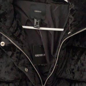 New with tags Forever 21 black velvet puffer coat.